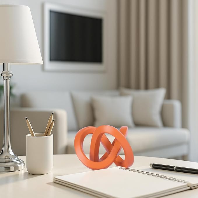 Orange knot decorative sculpture, orange home decor aesthetics, Möbius strip sculpture, suitable for decoration and display on bookshelves, living room TV cabinets, office cabinets, and coffee tables.