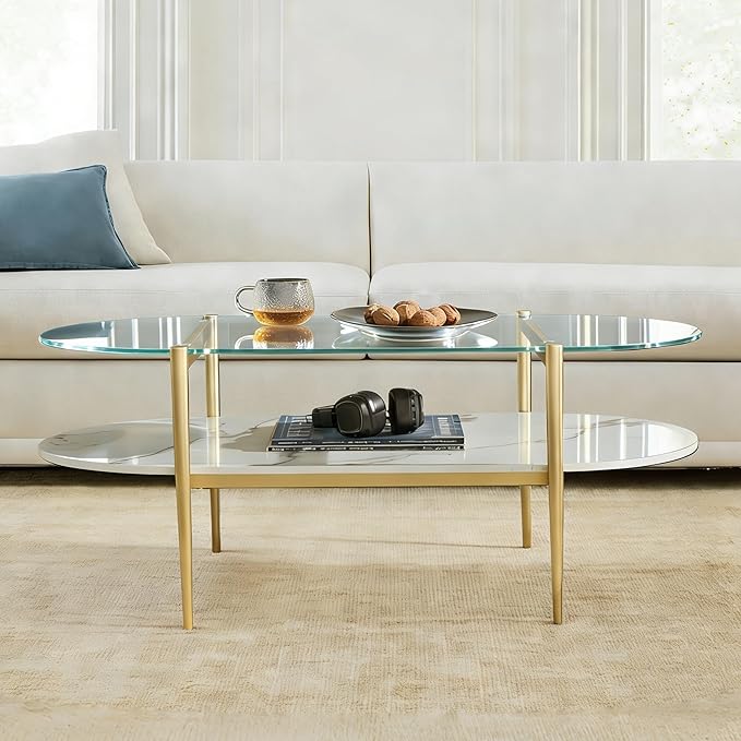 Shrine Oval Coffee Table, Mid-Century Modern Design, 2-Tier Structure, Clear Glass Top and White MDF Shelf, 47" D x 21" W x 17" H, Sleek Conical Metal Legs with Gold Finish