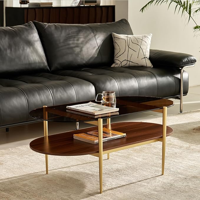Shrine Oval Coffee Table, Mid-Century Modern Design, 2-Tier Structure, Amber Glass Top and Walnut MDF Shelf, 47" D x 21" W x 17" H, Sleek Conical Metal Legs with Gold Finish