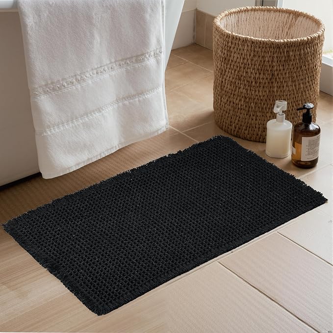 KGORGE Non Slip Black Waffle Bath Mat, Super Absorbent Quick Dry Soft Washable Small Bathroom Rugs with Tassels for Bathroom Floor Shower Tub Hotel Kitchen Entryway, 18" W x 30" L, 1 Piece
